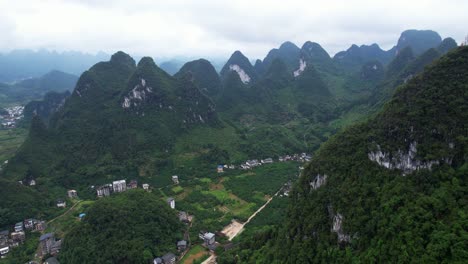 Aerial-view-of-green-karst-mountains-of-Xingping-Ancient-Town,-China