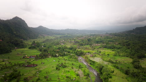 Indonesian-secluded-river-location,-misty-background,-green-landscape