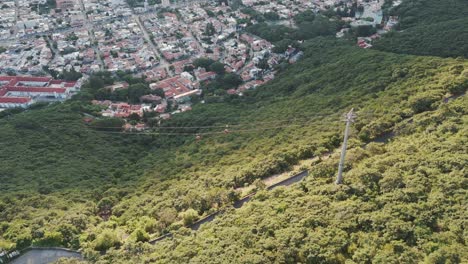 View-from-a-mountain-down-to-Cable-Cars-or-Gondolas-on-the-mountainside-of-Salta,-Argentina