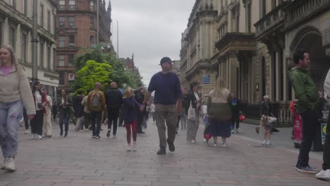 Families,-friends,-walking-together,-Buchanan-Street,-city-centre,-slow-mo