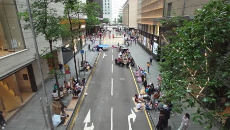 Overlooking-Street-With-Domestic-Helpers-Gathering-Together-On-Their-Day-Off