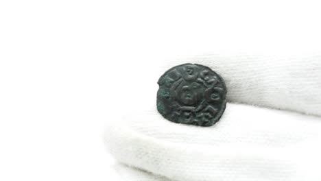 Numismatist-in-White-Gloves-Looking-at-Old-Coin-08