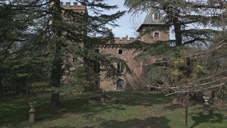 Travelling-in-above-the-entrance-fence-of-Perafita-Castle-in-Catalonia,-Spain