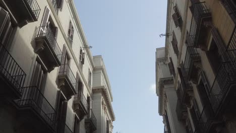 Highlight-the-intricate-architectural-details-of-Barcelona's-buildings-with-this-captivating-low-angle-view-of-building-facades