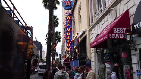 Los-Angeles-USA,-People-in-Front-Wax-Museum-and-Souvenir-Shops-on-Hollywood-Boulevard,-Slow-Motion