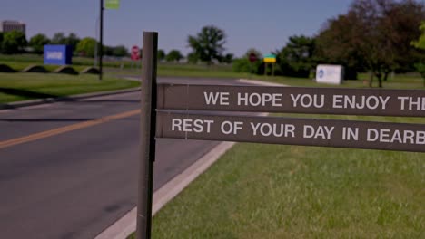 We-hope-you-enjoy-the-rest-of-your-day-in-Dearborn-sign-in-Dearborn,-Michigan-with-video-panning-left-to-right