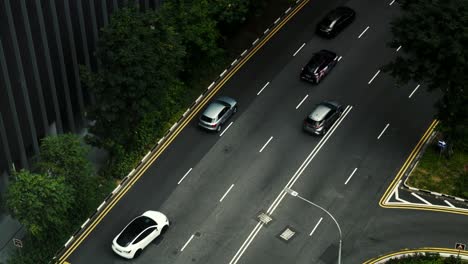 Top-down-time-lapse-of-cars-speeding-through-the-streets-of-Singapore