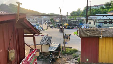 established-of-Cape-Coast-town,-Ghana-city-with-traffic-car-at-sunrise