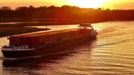 Goods-transported-past-Rotterdam-city,-Arion-Hendrik-Ido-Ambacht,-sunset