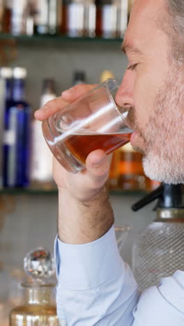 Businessman-having-a-glass-of-whisky