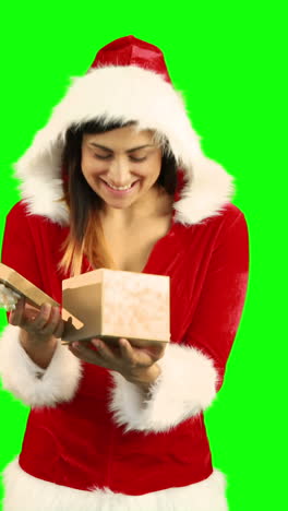 Sexy-girl-in-santa-costume-opening-a-gift