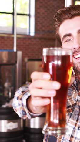 Brewery-worker-checking-the-product