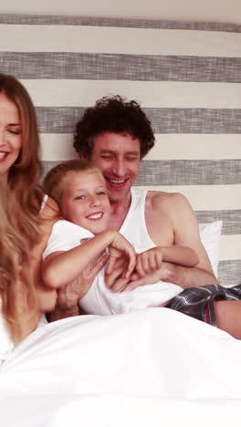 Happy-family-on-bed