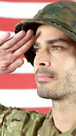 Soldier-saluting-in-front-of-American-flag