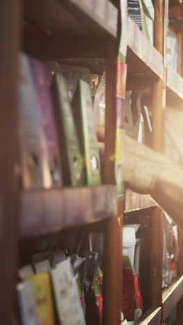 Staff-arranging-grocery-items-on-shelf