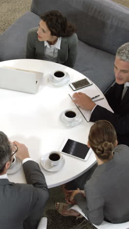 Business-people-sitting-in-circle