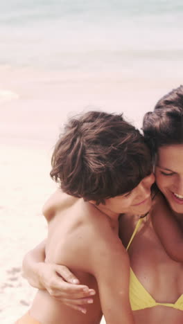 Cute-family-hugging-on-the-beach