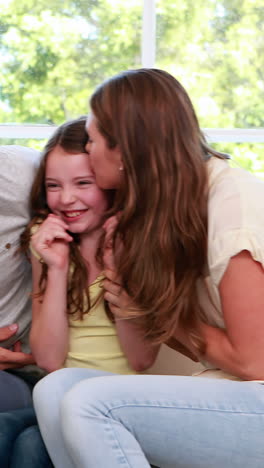 Happy-family-with-daughter-on-the-sofa