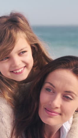 Young-smiling-mother-with-her-daughter