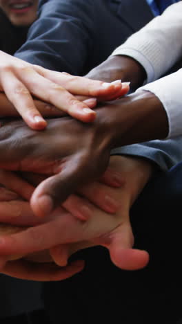 Businesspeople-forming-hands-stack