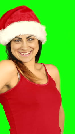 Pretty-girl-in-santa-hat-sending-an-air-kiss-to-camera