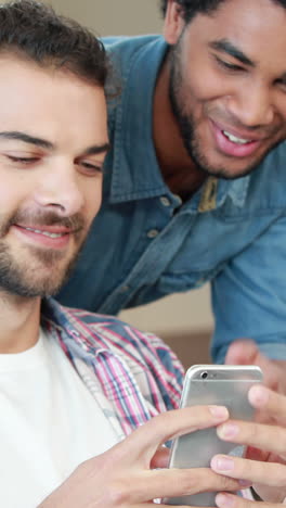 Gay-couple-on-smartphone-together