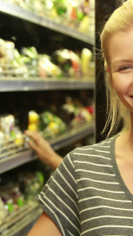 Smiling-blonde-with-paper-bag-searching-product