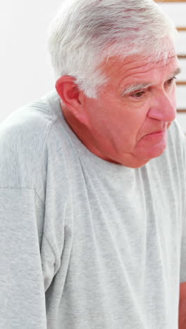 Smiling-doctor-talking-with-patient-using-zimmer-frame