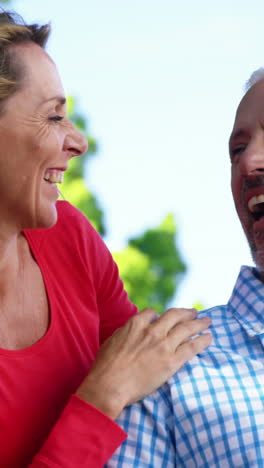 Portrait-of-mature-couple-is-looking-something-and-laughing