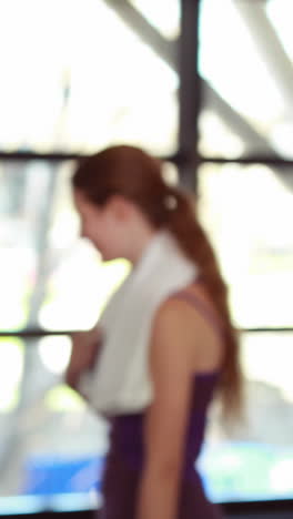 Fit-woman-smiling-at-camera-in-gym