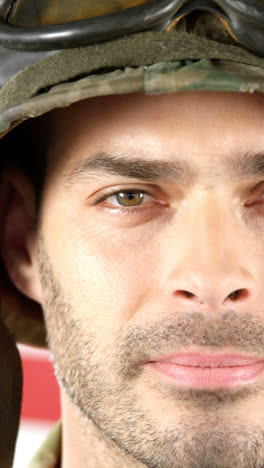 Soldier-standing-in-front-of-American-flag