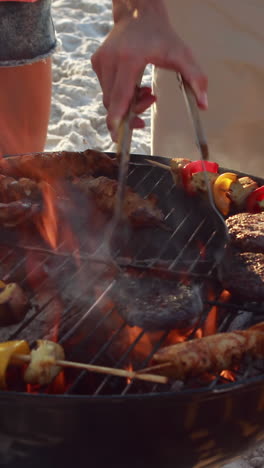 Close-up-of-friends-having-barbecue-together