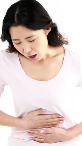 Pretty-Asian-woman-with-stomach-ache