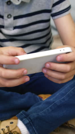 A-boy-playing-games-on-smartphone