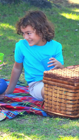 Happy-children-having-picnic-in-park