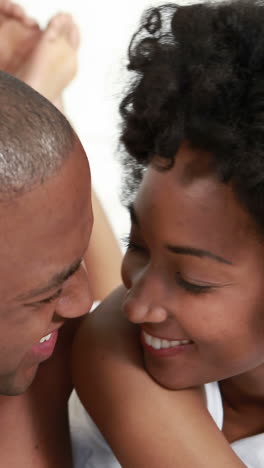 Smiling-young-couple-taking-selfies