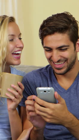 Man-taking-a-photo-of-himself-and-his-pretty-girlfriend