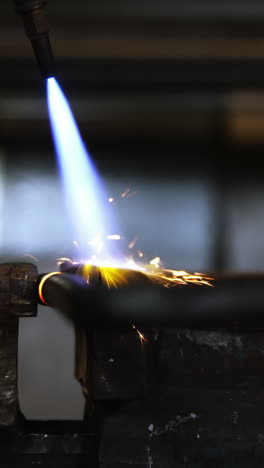 Close-up-of-welder-using-welding-torch