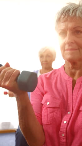 Group-of-senior-people-exercising-with-dumbbells