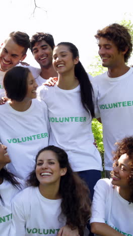 Group-of-volunteers-smiling-at-the-camera