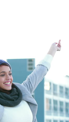 Happy-woman-raising-her-hands-up-