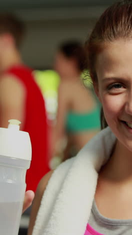 Fit-woman-drinking-from-water-bottle