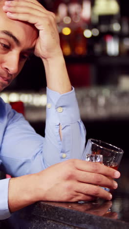 Worried-businessman-having-a-drink