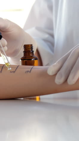 Close-up-of-woman-therapist-doing-allergy-tests-on-her-patient