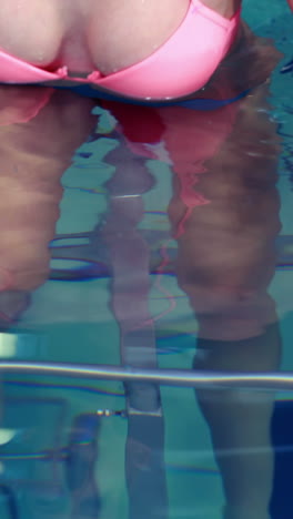 Fit-woman-cycling-in-the-pool