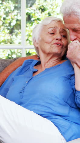 Senior-couple-talking-in-sitting-room