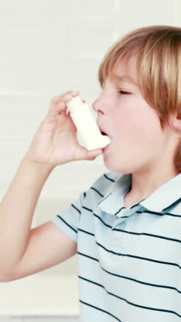 Boy-using-inhaler-