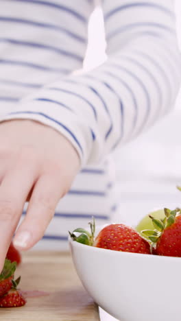 Woman-cutting-fruits