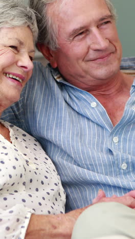 Senior-couple-embracing-in-living-room