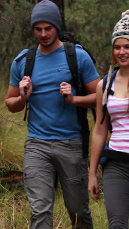 Happy-couple-hiking-and-taking-a-break